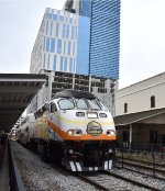 A morning Sunrail train departs Church Street Station heading to DeLand on an overcast morning 